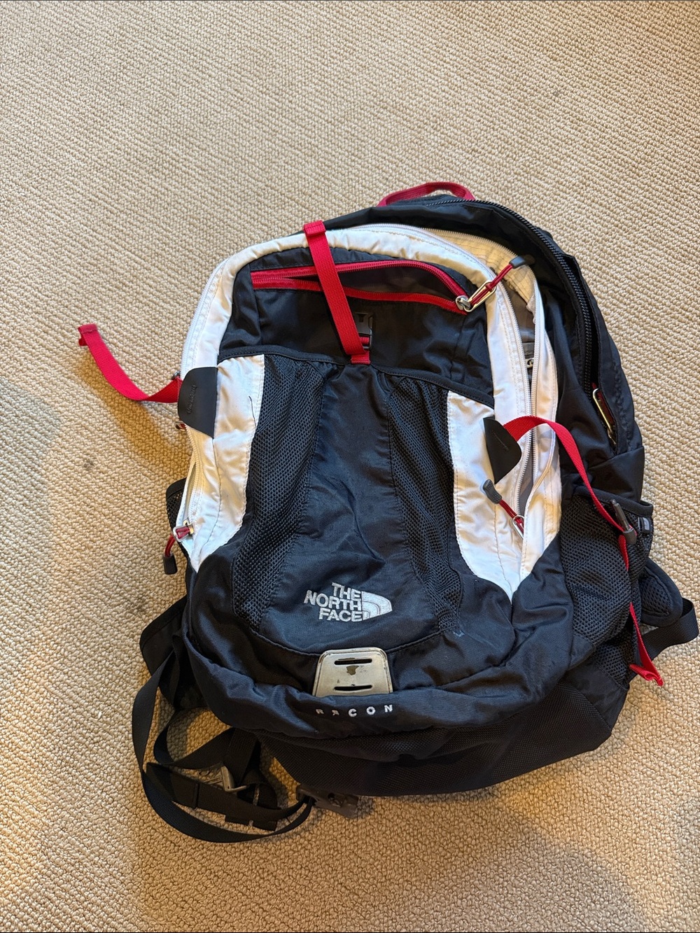 The North Face Black & White Backpack with Red Accents